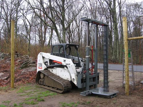 Skid steer and wire stretcher